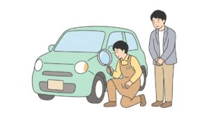 車の前部を点検する査定士と見守る父親